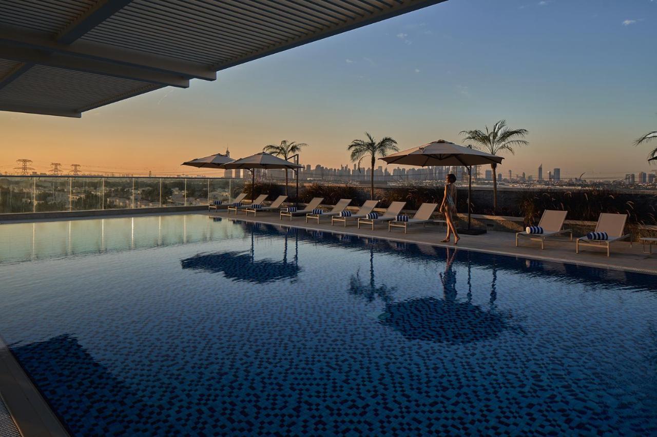 Movenpick Jumeirah Village Triangle Дубай Екстериор снимка The rooftop pool at the hotel