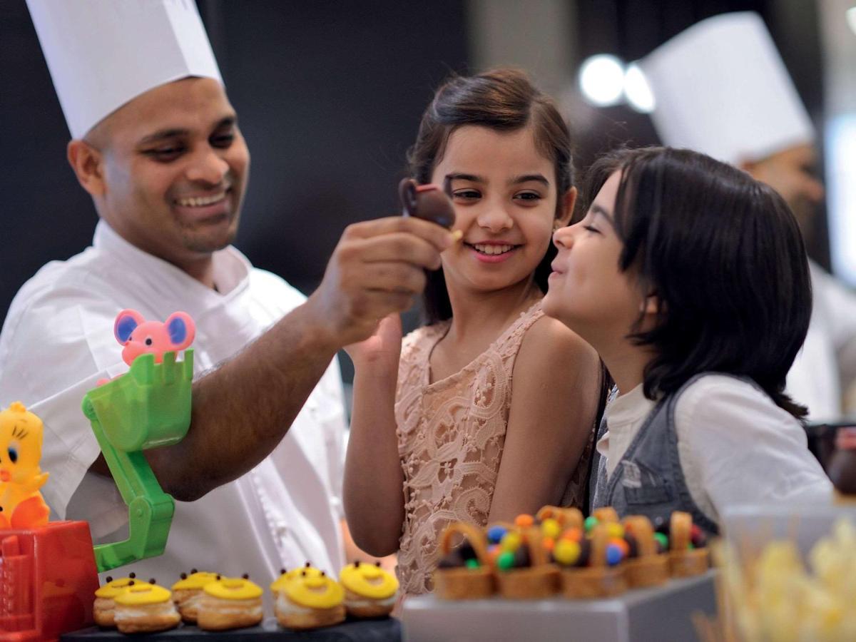 Movenpick Jumeirah Village Triangle Дубай Екстериор снимка A pastry chef at work
